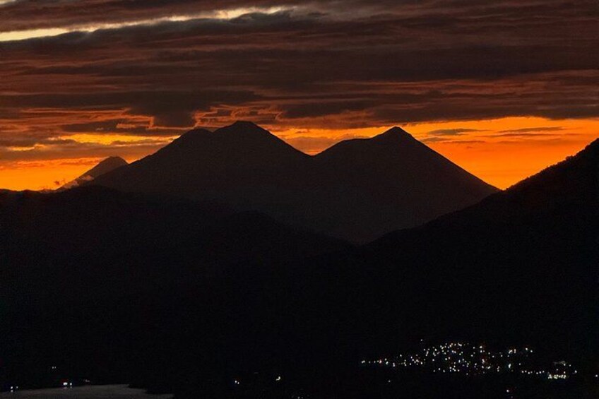 A mountain range silhouetted against a sunset sky. 3