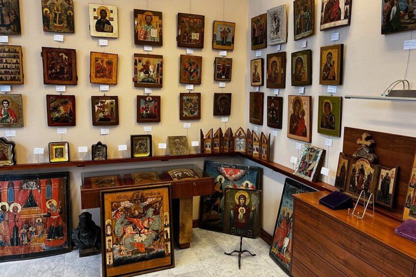A gallery with various religious icons and paintings on display. 2