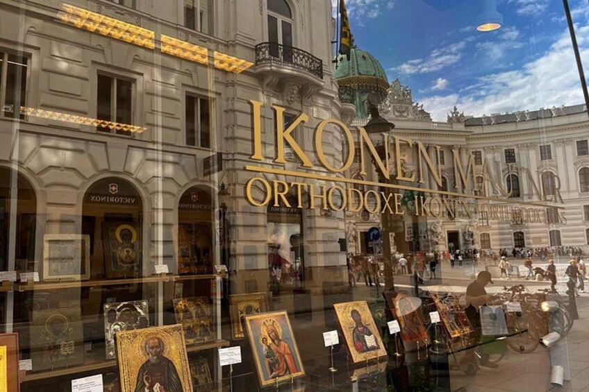 A building with ornate architecture and a large display of religious icons. 1