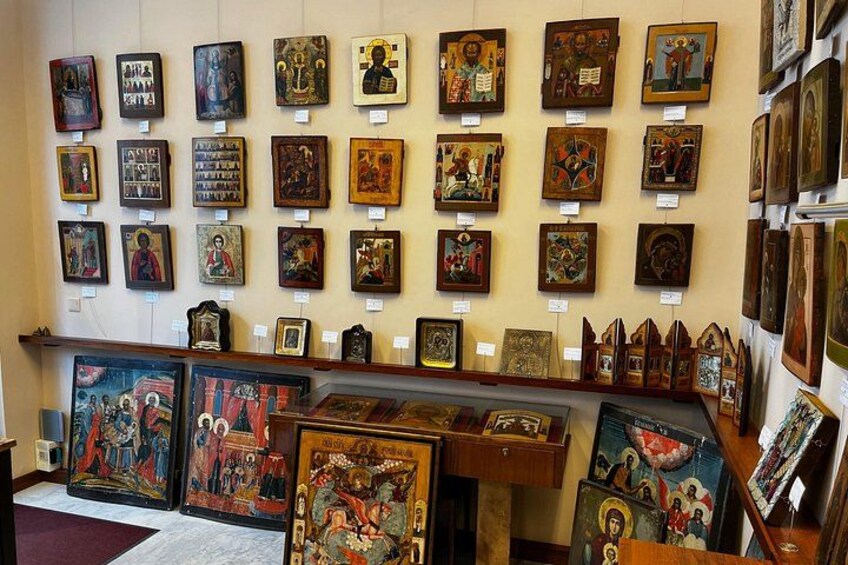 A gallery with various religious icons and paintings on display. 5