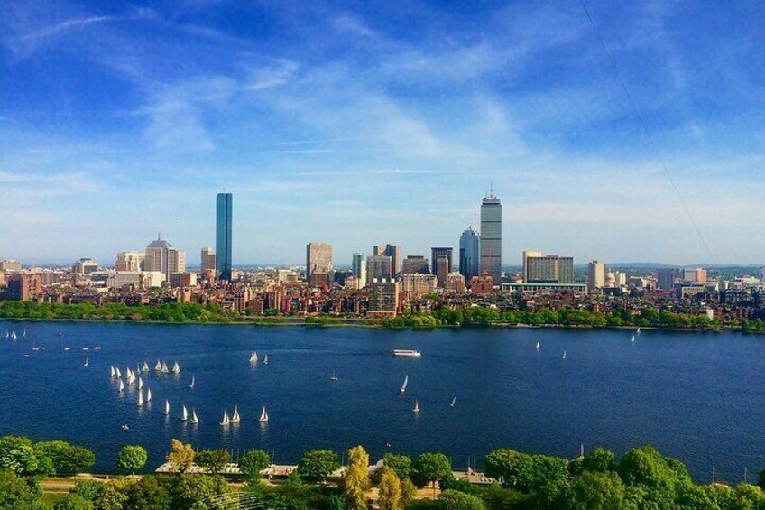 A city skyline with a river in the foreground. 5