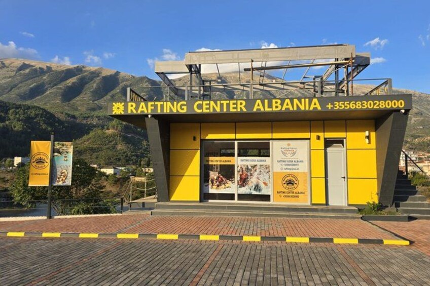 A rafting center with a mountain backdrop. 4