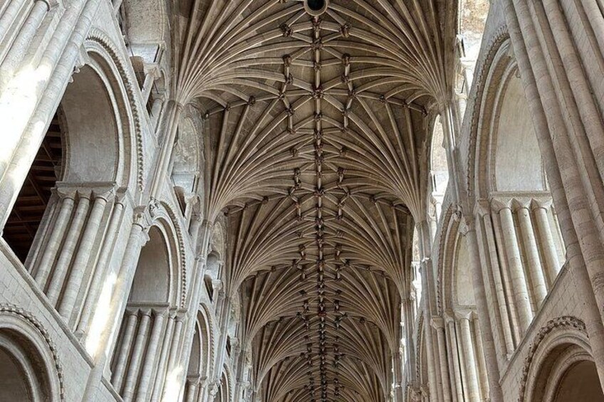 A cathedral interior with pointed arches, ribbed vaults, and a series of columns. 2