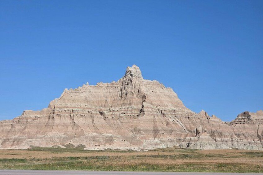 A large, rugged mountain with a clear sky. 3