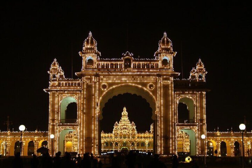 A brightly lit archway with intricate designs and lights. 1