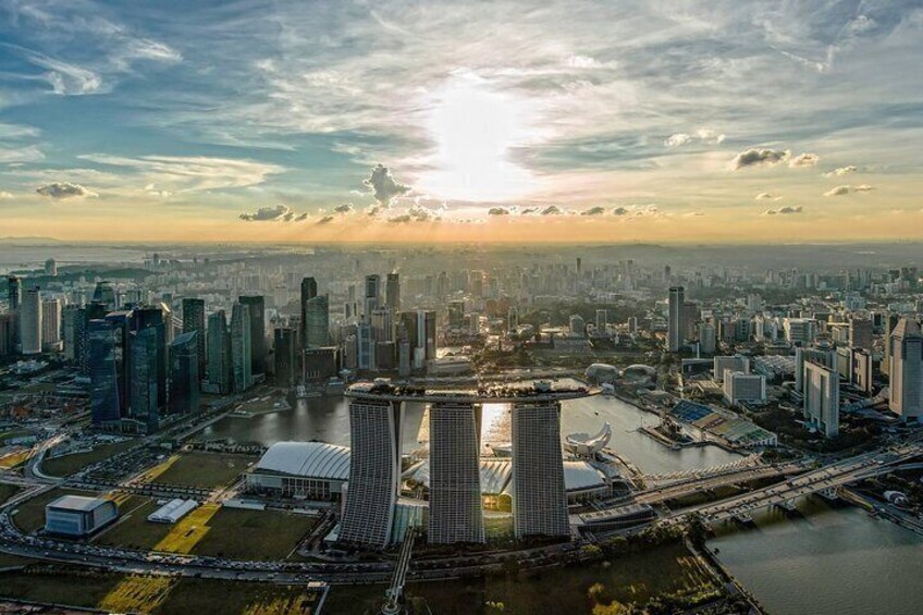 A cityscape with modern skyscrapers, a river, and a distinctive building with two towers. 4
