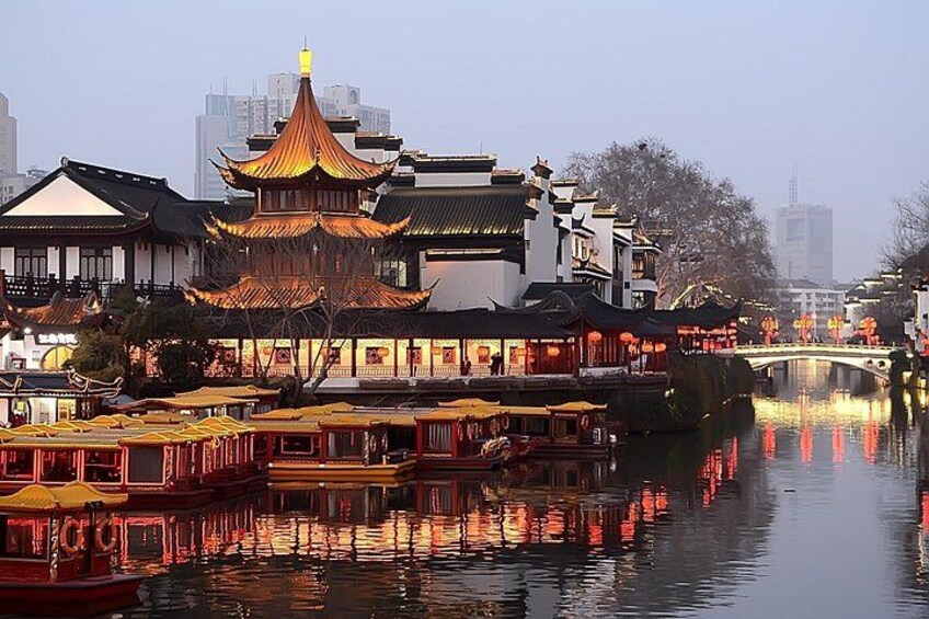 Traditional Chinese architecture, a river with boats, and a bridge. 5
