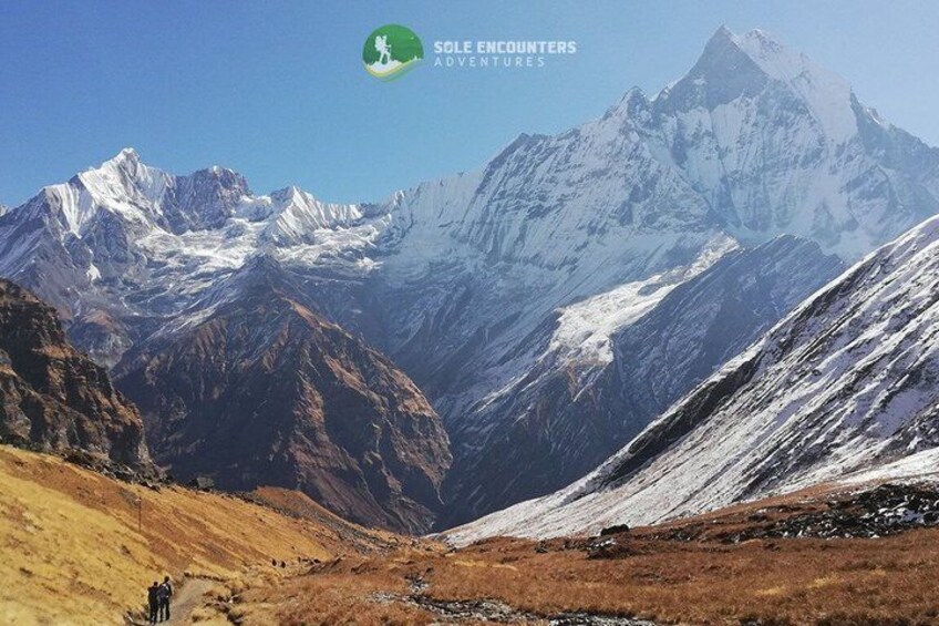 A mountainous landscape with snow-capped peaks and a valley. 5