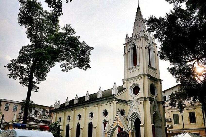 A church with a tall tower and arched windows. 2