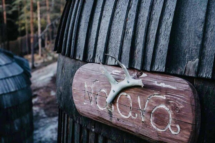 A wooden sign with the name 'Havoc' and a metal object resembling a horse's head. 5
