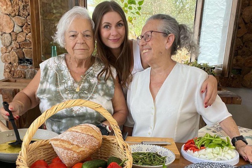Three people at a table with bread, vegetables, and a basket. 5