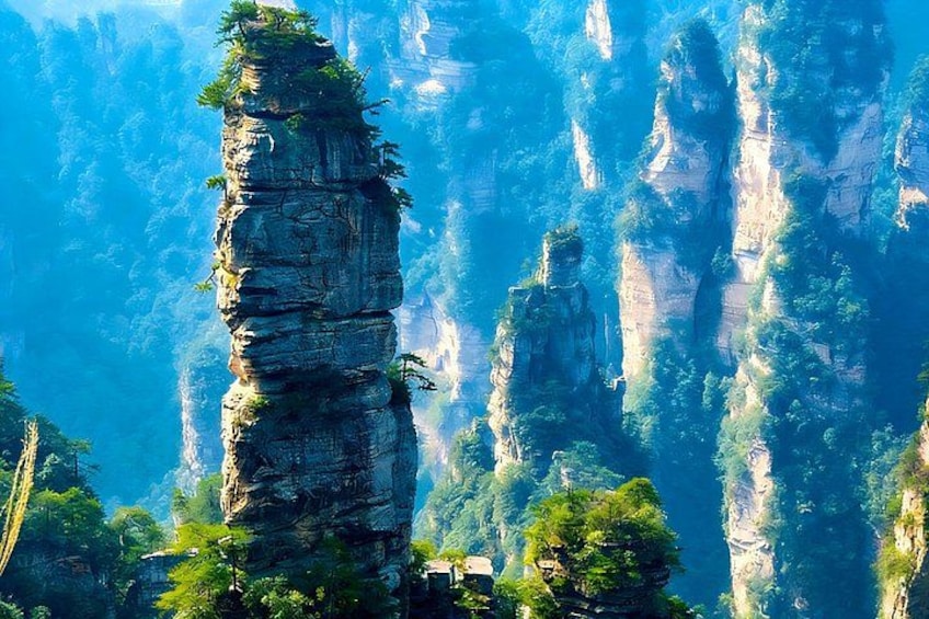 Towering rock formations with dense green foliage. 3