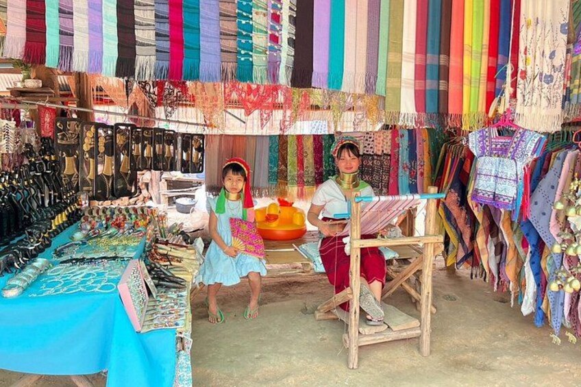 A market stall with colorful textiles and jewelry. 5