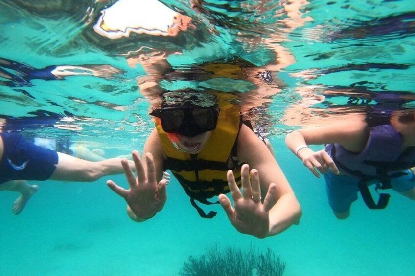 Underwater swimmers with fins and life vests. 2