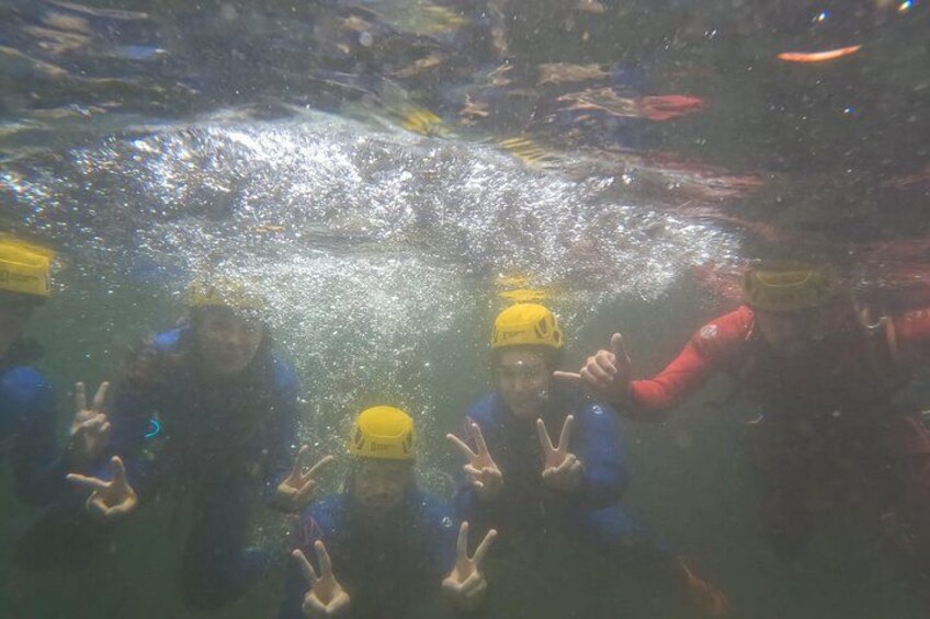 People underwater with scuba gear, bubbles, and a diver's mask. 3