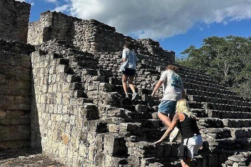 People climbing ancient stone steps. 3