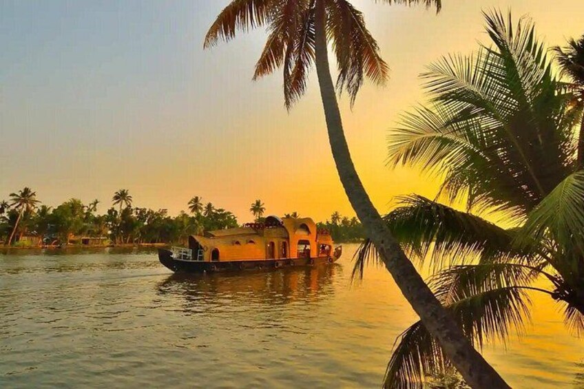 A boat on calm water, palm trees, and a sunset. 4