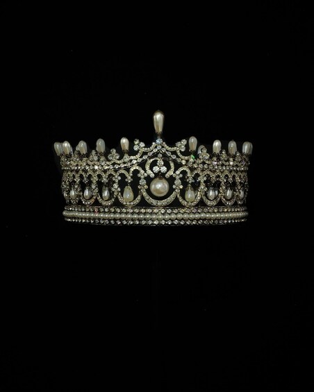 A detailed tiara with pearls and gemstones. 5