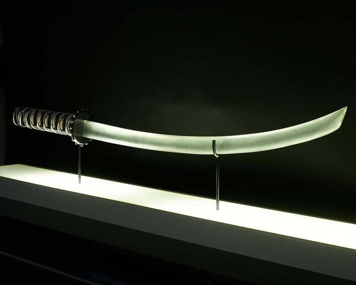A sword on a display stand. 4