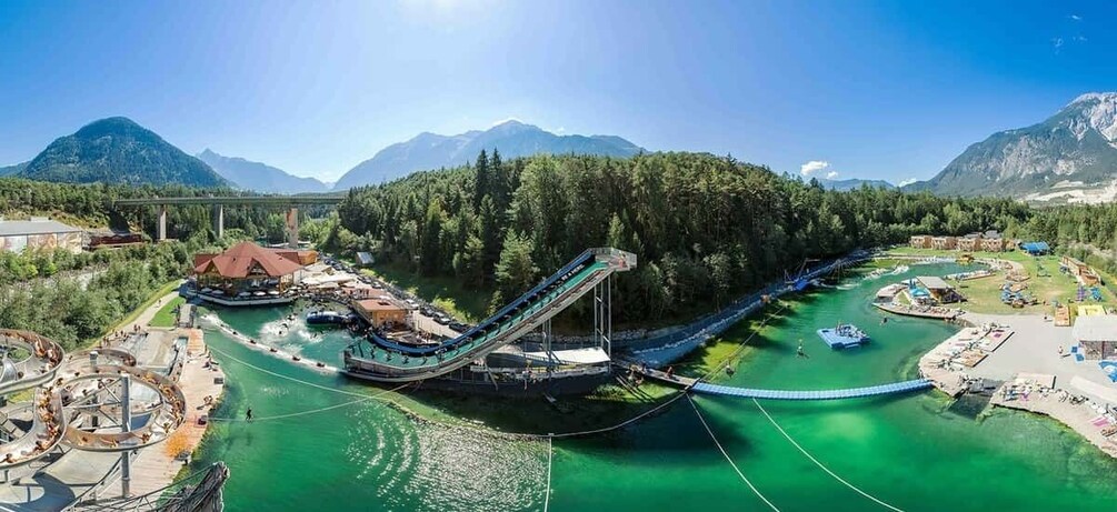 A water park with a water slide, a boat ramp, and a pool. 1