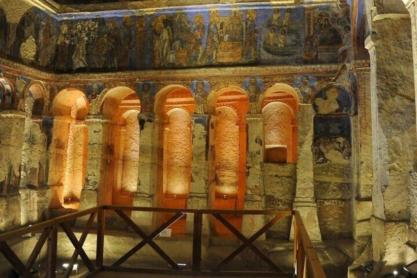 A historical building with ancient frescoes and stone columns. 3