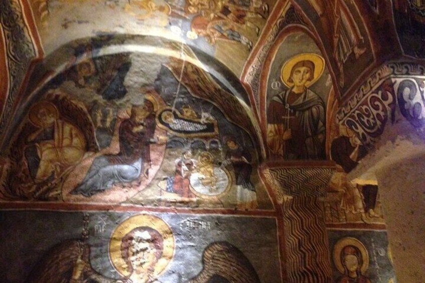 A detailed mosaic with religious figures and geometric patterns. 2