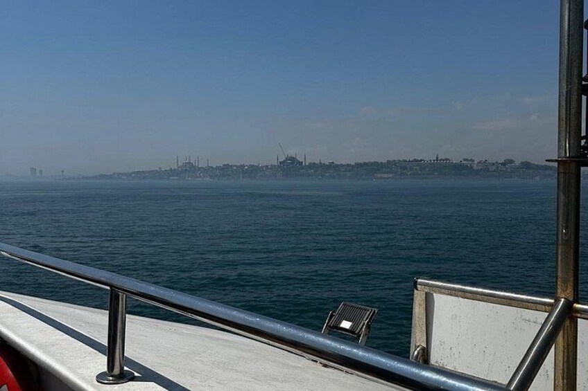 A body of water with a distant city skyline. 2