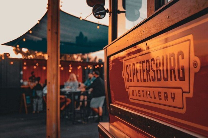 A wooden structure with 'St. Petersburg Distillery' signage. 5