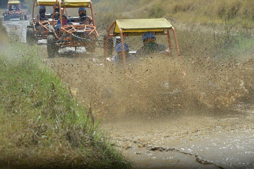 Off-road vehicles navigating a muddy terrain. 4