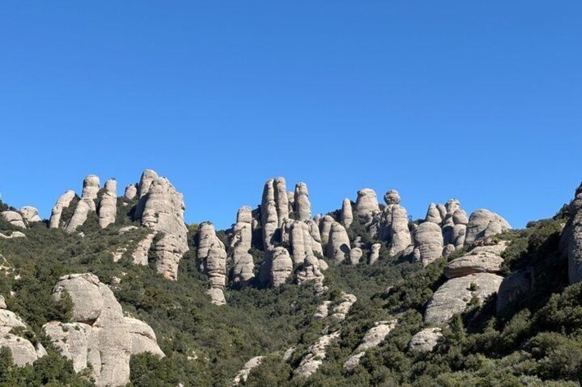 A mountainous landscape with prominent rock formations. 5