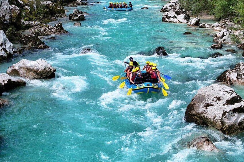 A river with rapids, surrounded by rocks and greenery. 4