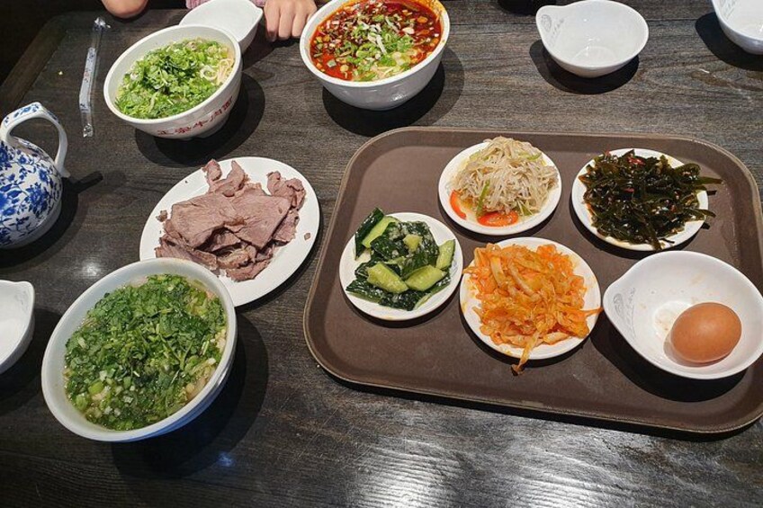 Traditional Food: Beef noodles with some side dishes ( boiled egg, vegetables) 2