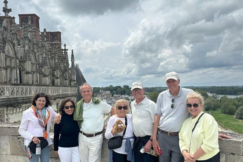 A group of people standing in front of a historic cathedral with intricate architecture. 2