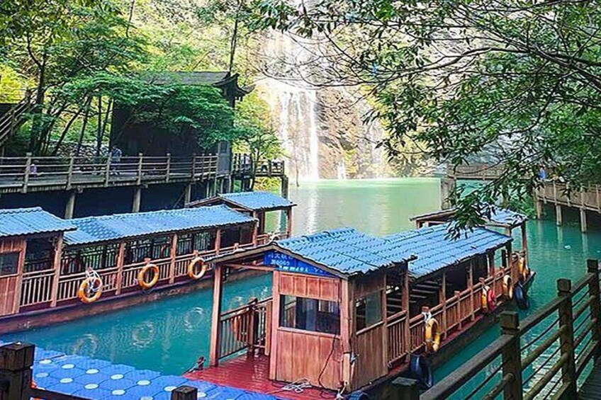 Wooden floating structures with a waterfall in the background. 4