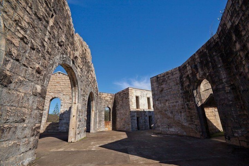 Ancient stone ruins with arches and walls. 1