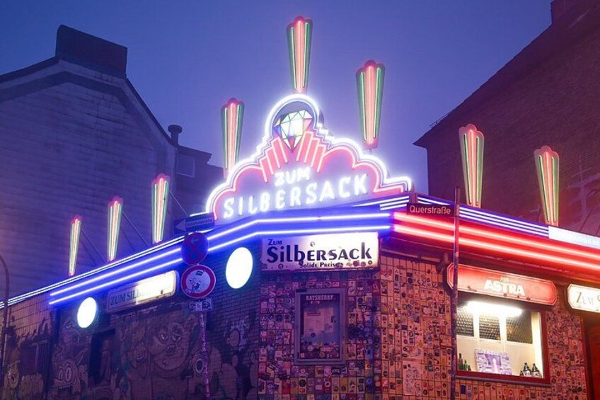A building with a neon sign that reads 'Silbersack.' 1