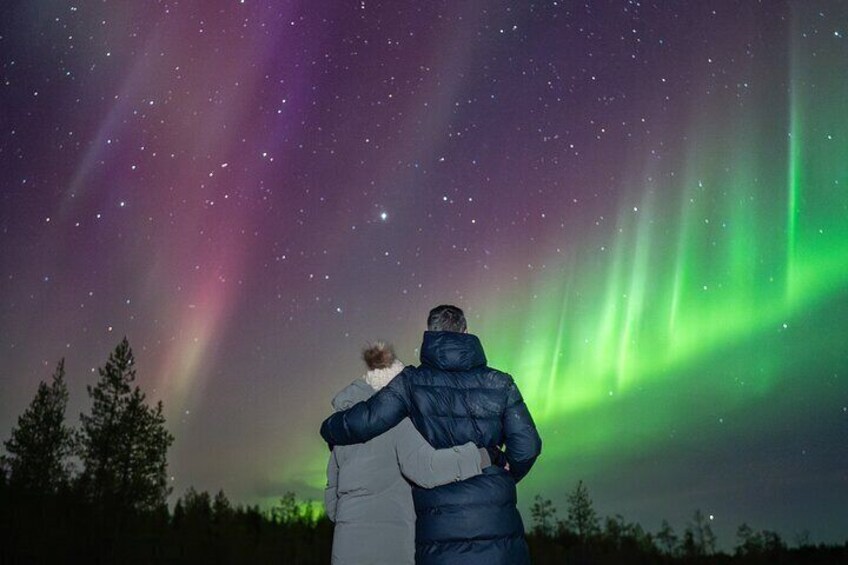 Two people observing the Northern Lights. 4