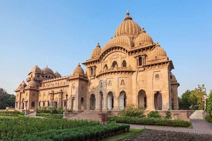 A large, ornate building with multiple domes and arched windows. 4