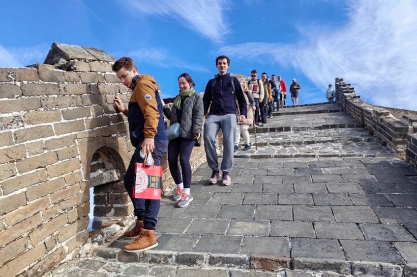 A group of people walking on a stone staircase. 1