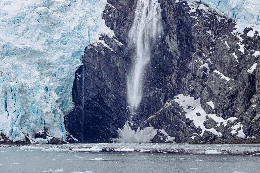 Ice falls off of Blackstone Glacier and crashes into the ocean on the Glacier Quest Cruise. 2