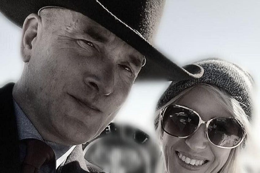 A person wearing a hat and sunglasses. 4