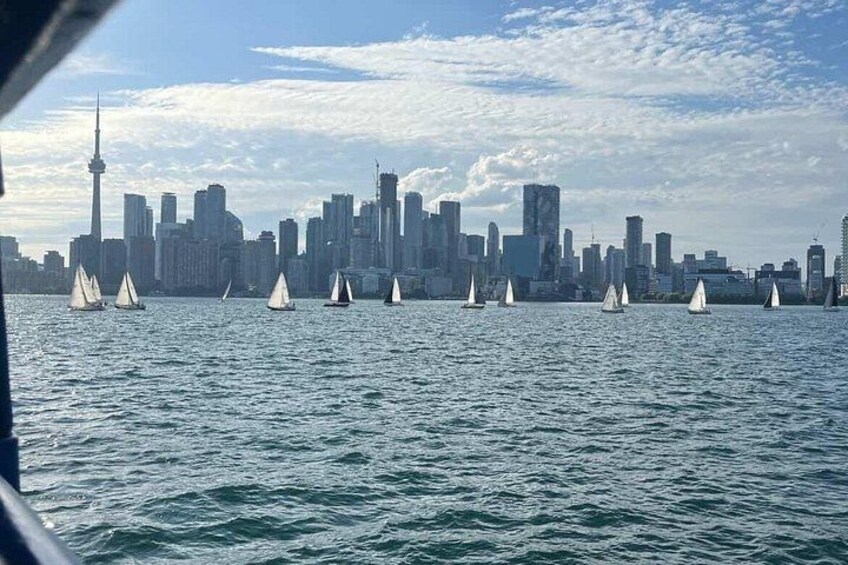 A city skyline with sailboats on the water. 4