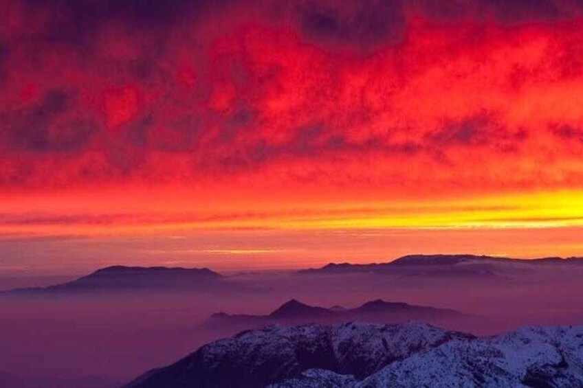 A mountain range with a sunset sky. 2
