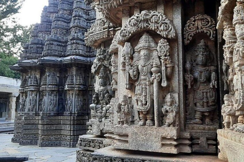 Intricately carved stone temple structures with detailed sculptures. 3