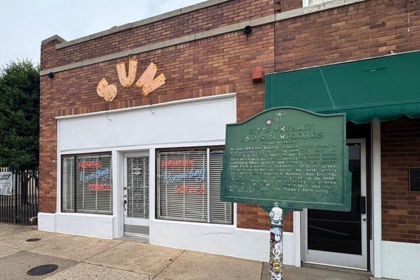 A building with a sign reading 'SUN' and a plaque for Elvis Presley and Sun Records. 4