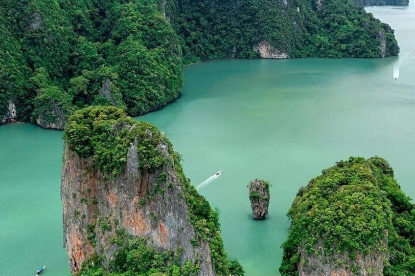A river winding through a mountainous landscape with lush greenery and rocky outcrops. 3