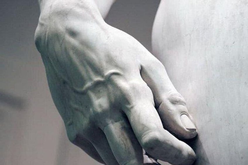 A close-up of a marble statue's hand. 2