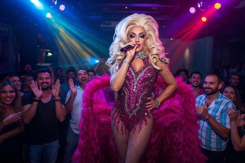 A person in a sequined dress with a feather boa, performing on stage with an audience. 5