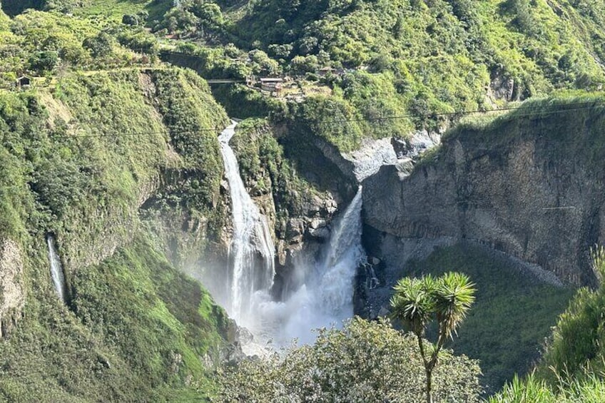 A waterfall cascading down a steep cliff surrounded by lush greenery. 5