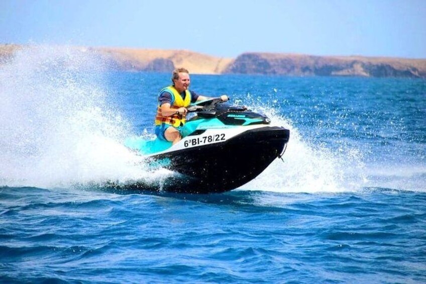 A person riding a jet ski on the water. 4